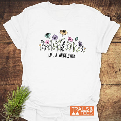 Like A Wildflower T-Shirt featuring a detailed flower drawing, crafted from soft ring-spun cotton for comfort and durability, ideal for outdoor adventures.