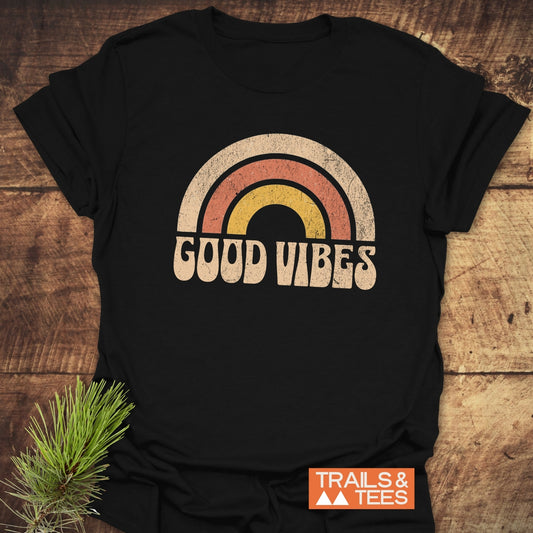 Good Vibes T-Shirt featuring a rainbow design on soft, lightweight ring-spun cotton. Pre-shrunk with durable prints, ideal for everyday adventures.