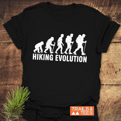 Hiking Evolution T-Shirt featuring a white text and silhouette design of a person with a backpack, ideal for active wear enthusiasts.