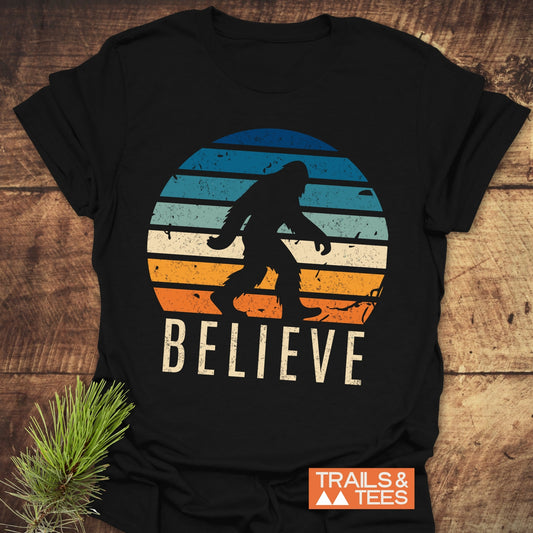 Believe Bigfoot T-Shirt featuring a bold graphic design of the letter V prominently displayed, perfect for active wear enthusiasts seeking unique style.