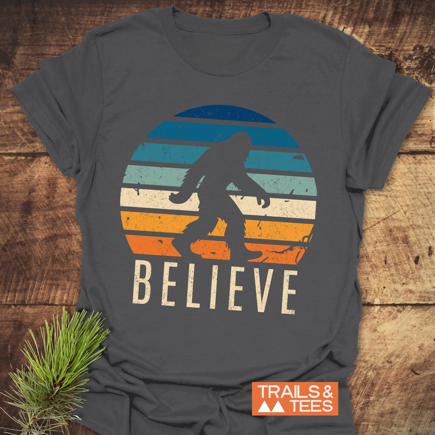 Believe Bigfoot T-Shirt featuring a graphic of Bigfoot on the front, designed as an active shirt, highlighting a playful and adventurous theme.