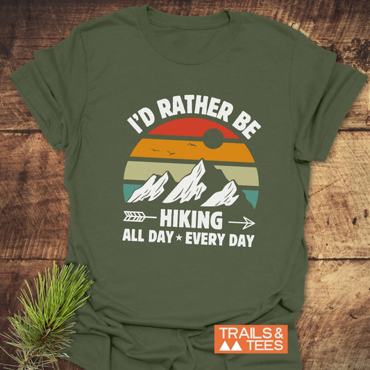 I'd Rather Be Hiking All Day Every Day T-Shirt featuring a graphic design, ideal for active wear enthusiasts, highlighted in a close-up shot of the shirt.