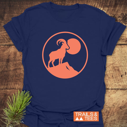 Mountain Goat T-Shirt featuring a goat and pine branch design, crafted from soft, lightweight cotton for comfort, durability, and a reliable fit.