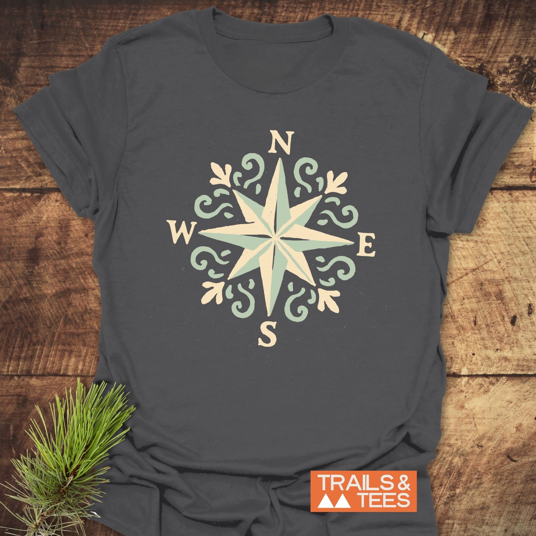 Compass Rose T-Shirt featuring a compass design, crafted from soft ring-spun cotton, offering comfort and durability for outdoor enthusiasts.