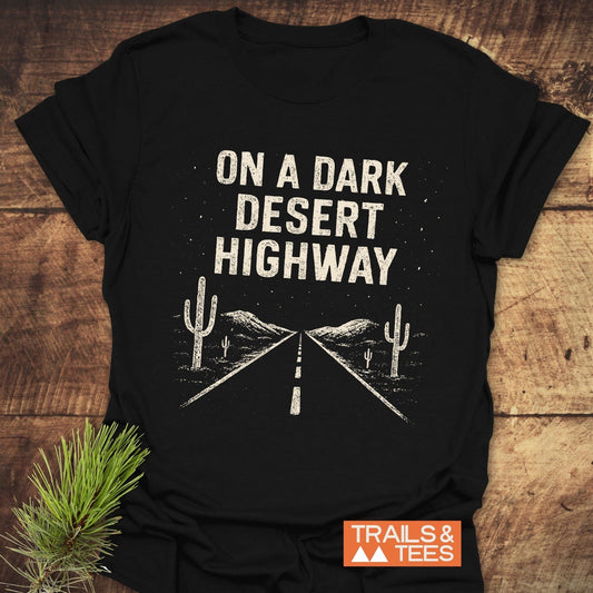 On A Dark Desert Highway T-Shirt featuring durable white text on a black background, crafted from soft ring-spun cotton for everyday outdoor adventures.