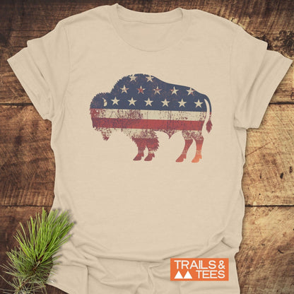 Land Of The Free Bison T-Shirt featuring a flag design, showcasing durable prints and timeless style, ideal for outdoor adventures.