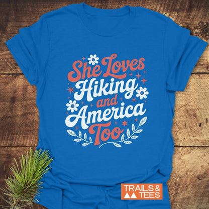 She Loves Hiking And America Too T-Shirt featuring durable white text on a blue active shirt, crafted for comfort and outdoor adventures.