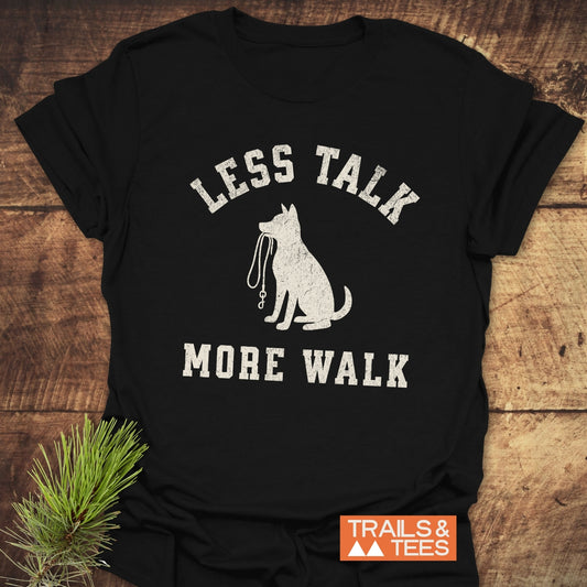 Less Talk, More Walk T-Shirt featuring a dog silhouette with a leash. Crafted from soft ring-spun cotton, ideal for outdoor enthusiasts.