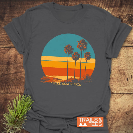 Charcoal-grey Hike California T-Shirt featuring a retro palm tree graphic, crafted from soft cotton, offering comfort and durability for outdoor adventures.