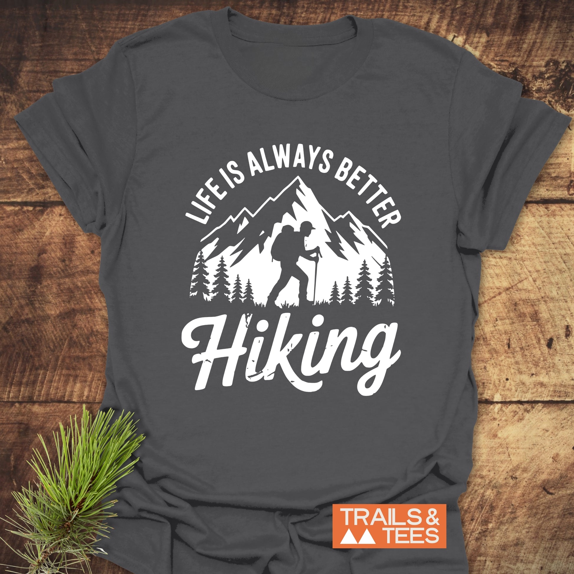 Life Is Always Better Hiking T-Shirt featuring mountain and forest graphic, crafted from soft ring-spun cotton, ensuring comfort and durability for outdoor enthusiasts.