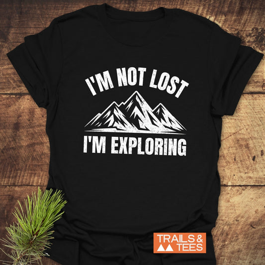 I'm Not Lost I'm Exploring T-Shirt with a mountain graphic, crafted from soft cotton for comfort. Features durable prints, pre-shrunk fit, and eco-friendly production.