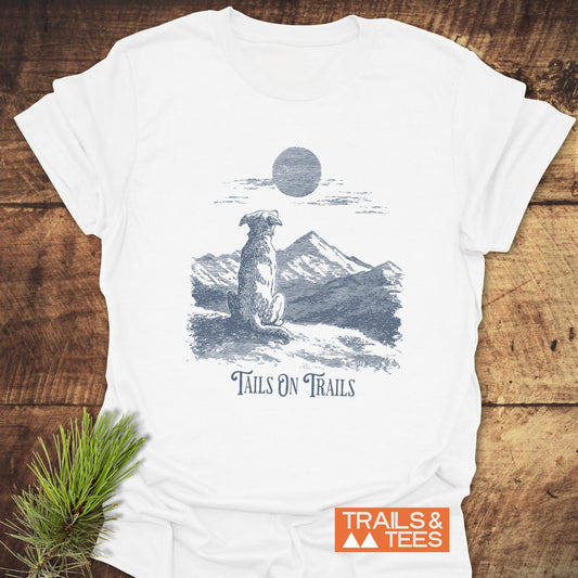 Tails On Trails T-Shirt featuring a dog illustration on a ridge, crafted from soft cotton for comfort, ideal for outdoor enthusiasts.