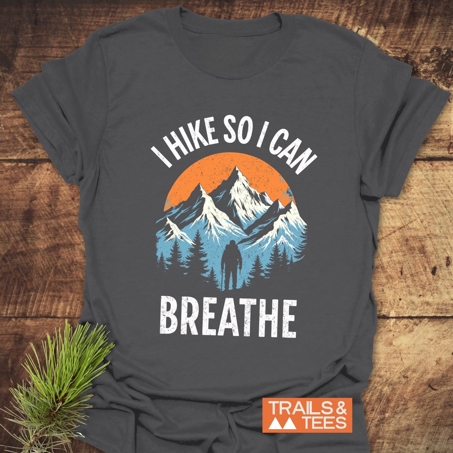 I Hike So I Can Breathe T-Shirt featuring a mountain scene print, crafted from soft cotton, showcasing outdoor-loving design and comfort.