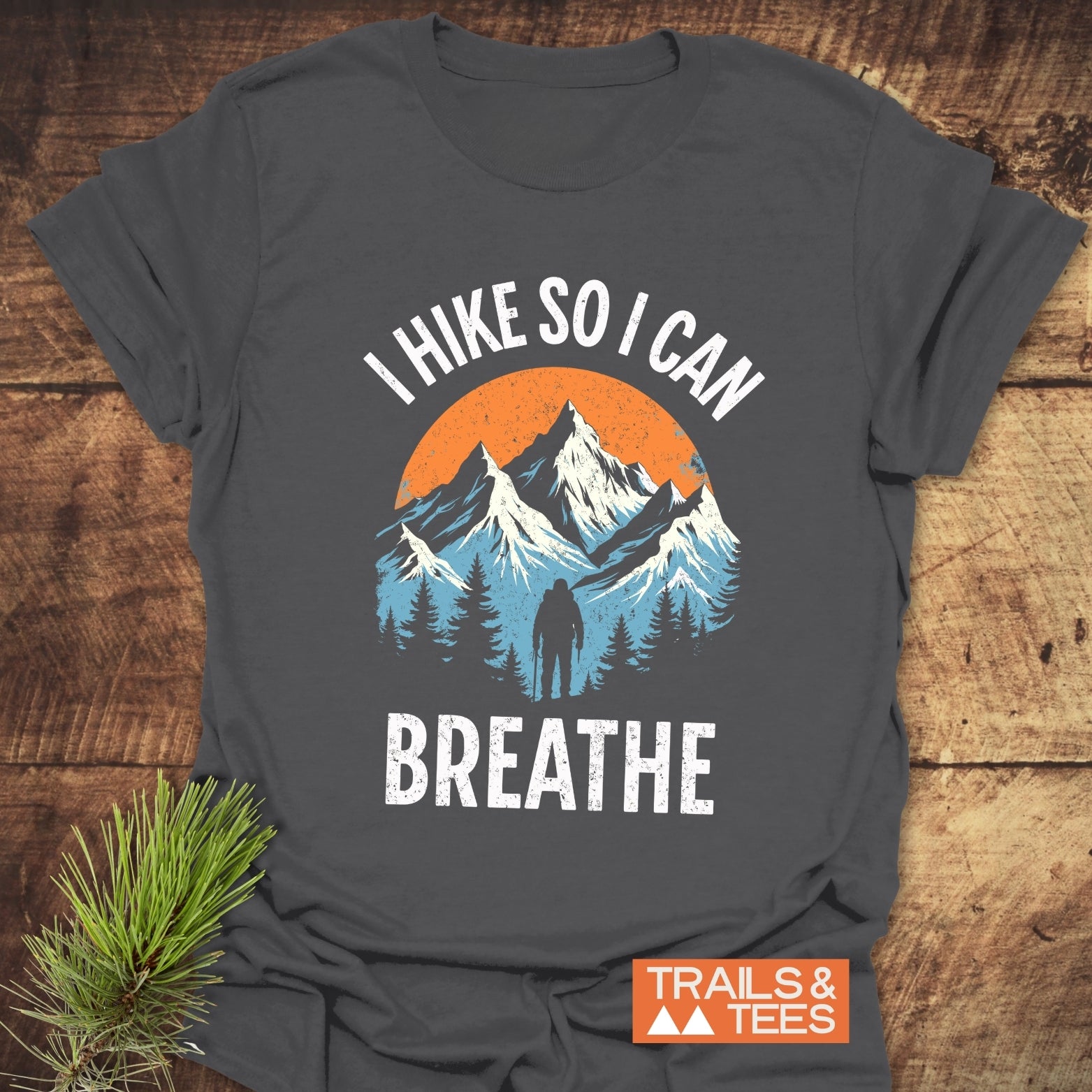 I Hike So I Can Breathe T-Shirt featuring a mountain scene print, crafted from soft cotton, showcasing outdoor-loving design and comfort.