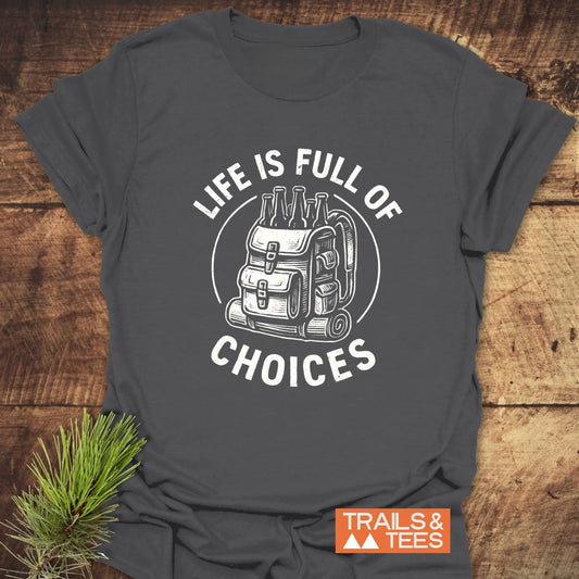 Life Is Full Of Choices T-Shirt featuring a backpack and beer bottle design, emphasizing outdoor adventure. Made from soft, durable cotton with a Trails & Tees logo.