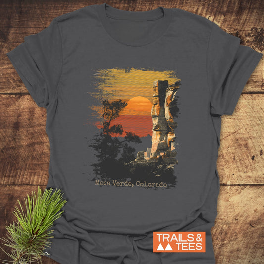 Mesa Verde, Colorado T-Shirt featuring a sunset scene with trees and rock formation, crafted from soft ring-spun cotton for comfort and durability.