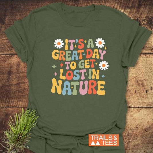 It's A Great Day To Get Lost In Nature T-Shirt, featuring a retro slogan with daisies and sparkles, on soft, lightweight ring-spun cotton for outdoor adventures.