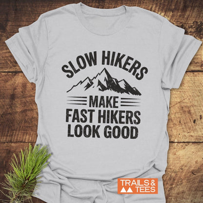 Light-gray Slow Hikers T-Shirt featuring a distressed mountain graphic. Made from soft ring-spun cotton, designed for comfort and durability.