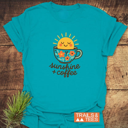 Sunshine And Coffee T-Shirt featuring a smiling sun in a flower-patterned coffee cup graphic, highlighting comfort and durability, perfect for outdoor enthusiasts.