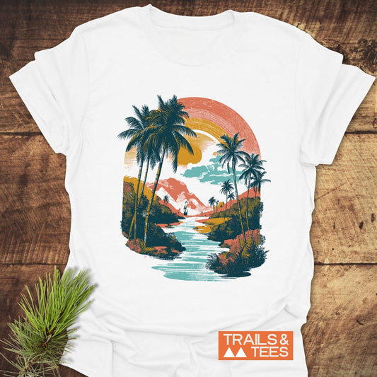 Along The River T-Shirt, featuring a retro tropical landscape print, emphasizes comfort and durability with its soft, ring-spun cotton and reliable fit.
