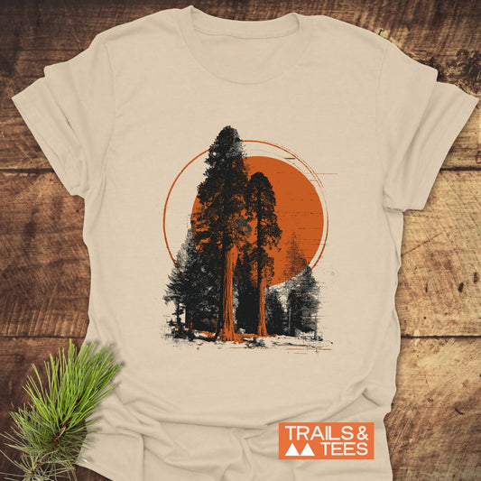 Sequoia T-Shirt featuring two conifer trees silhouetted against an orange circle, highlighting outdoor adventure. Crafted from soft cotton for comfort and durability.
