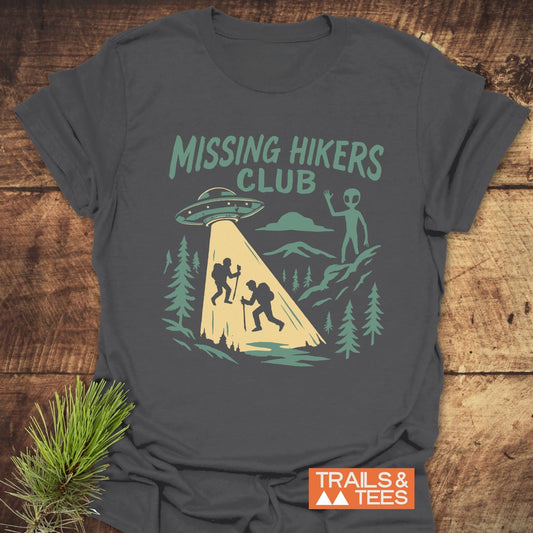 Missing Hikers Club T-Shirt with vintage graphic of hikers and UFO, crafted from soft ring-spun cotton, offering trail-tested comfort and durable print.