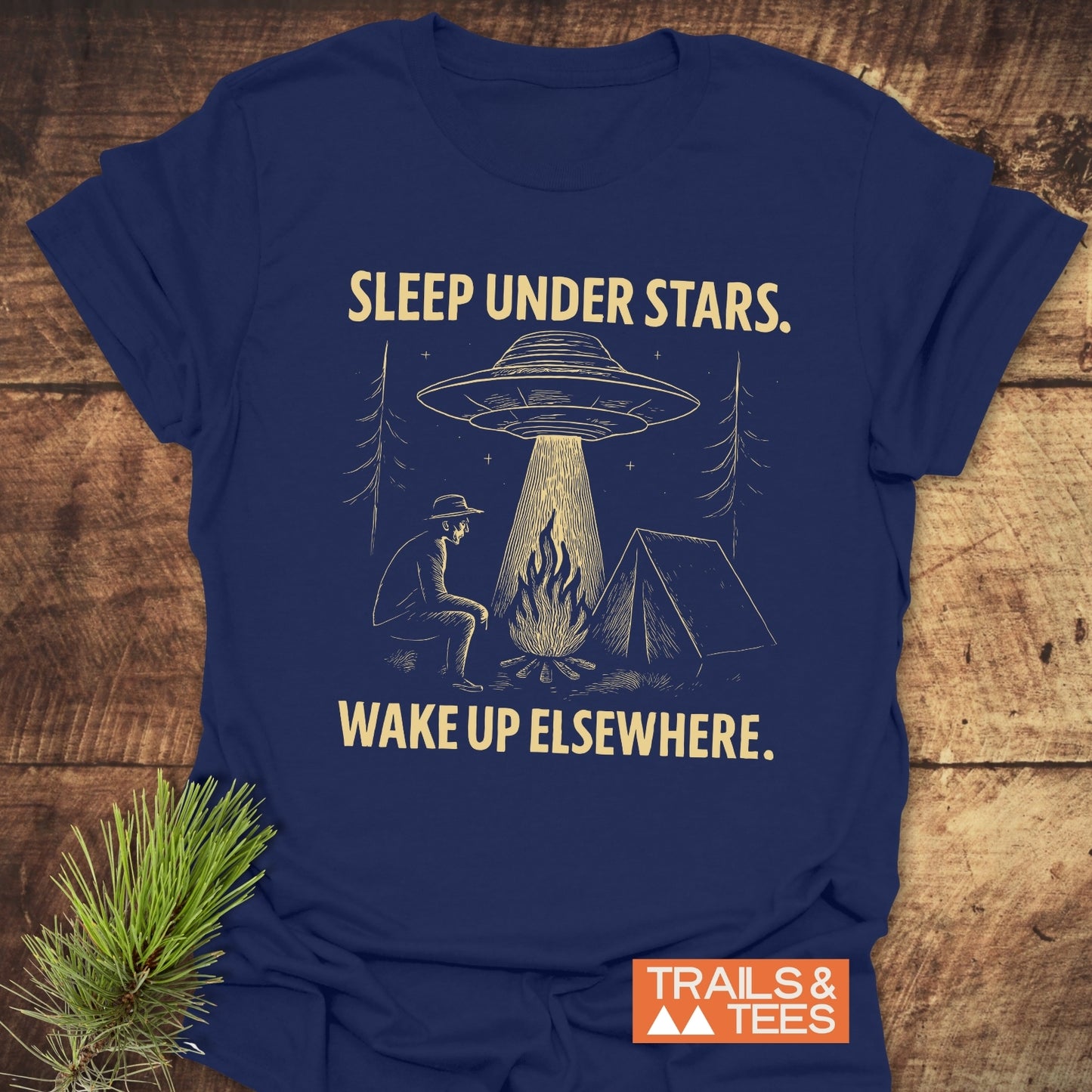 Sleep Under Stars UFO T-Shirt featuring a camping scene with UFO, crafted from soft cotton, durable print, pre-shrunk for comfort. Designed for outdoor enthusiasts.