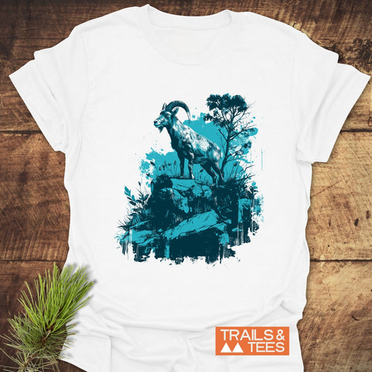 Wild and Steady – Mountain Goat T-Shirt featuring a mountain goat graphic, crafted from soft ring-spun cotton with an orange “TRAILS & TEES” logo.