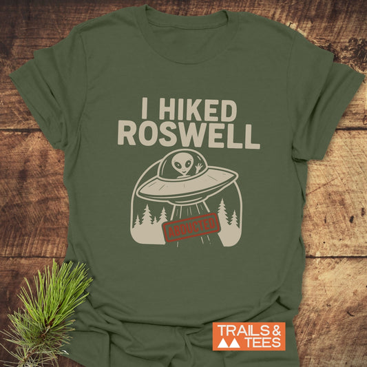 I Hiked Roswell T-Shirt featuring an alien graphic and slogan, made from soft ring-spun cotton with durable prints, designed for outdoor enthusiasts.