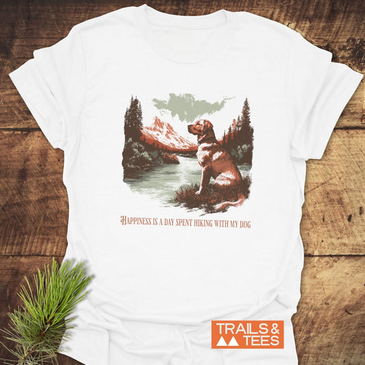 Happiness Is Hiking With Dogs T-Shirt featuring a mountain lake scene with a dog, crafted from soft cotton, emphasizing comfort and outdoor adventure.