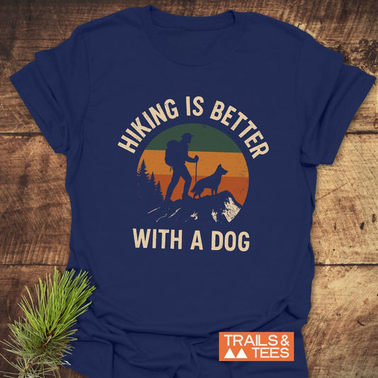 Navy-blue Hiking Is Better With A Dog T-Shirt featuring retro graphic of hiker and dog, crafted from soft cotton, with durable print and comfort-focused design.