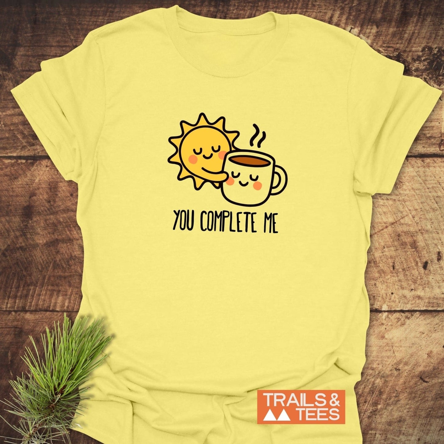 Light yellow You Complete Me - Sun & Coffee T-Shirt featuring a smiling sun and coffee mug print, crafted from soft cotton for comfortable outdoor adventures.