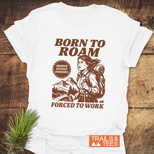 Born To Roam T-Shirt featuring a female hiker illustration and outdoor slogans, crafted from soft ring-spun cotton for comfort and durability.