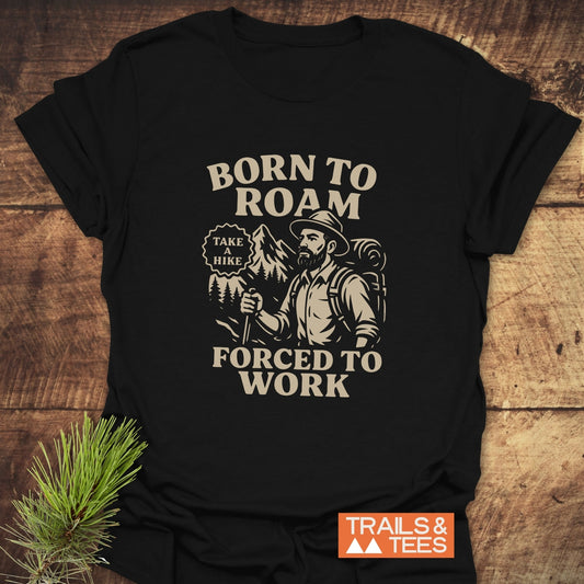 Born To Roam T-Shirt with bearded hiker graphic, Born To Roam, Forced To Work slogan, crafted from soft cotton, ideal for outdoor enthusiasts.