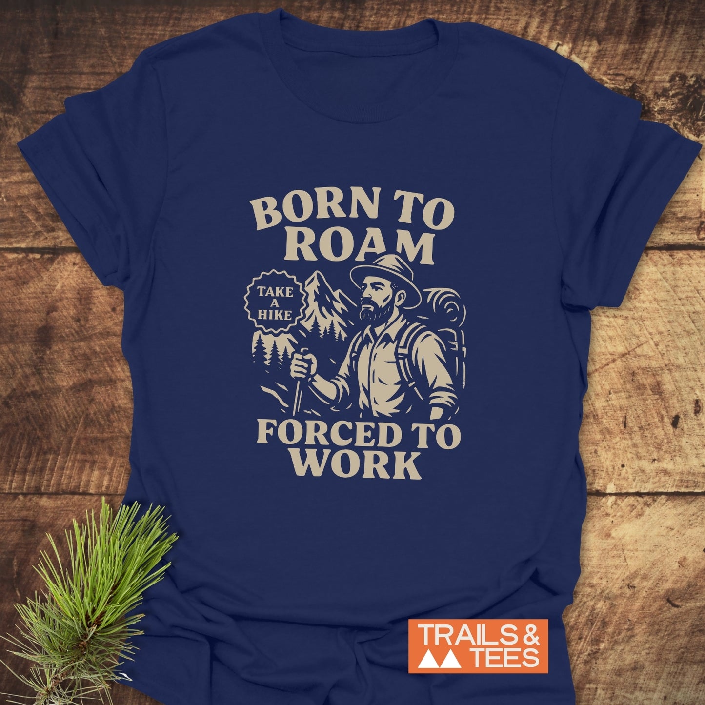 Born To Roam T-Shirt featuring a vintage-style graphic of a bearded backpacker with mountains, highlighting outdoor adventure spirit and comfort-focused design.