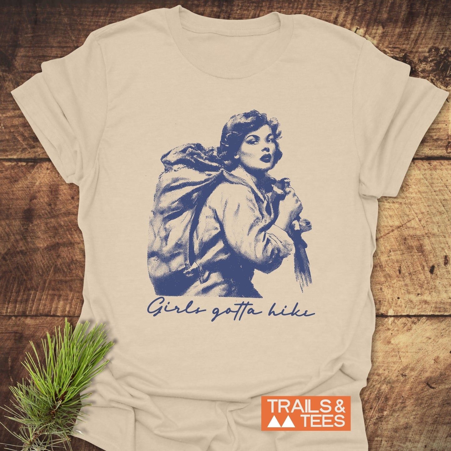 Girls Gotta Hike T-Shirt featuring a vintage-style illustration of a backpacker. Crafted from soft cotton, perfect for outdoor adventures and everyday wear.
