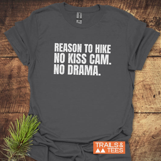 Charcoal T-shirt with slogan Reason To Hike: No Kiss Cam. No Drama. Trails & Tees logo; pine sprig accentuates the outdoor theme.