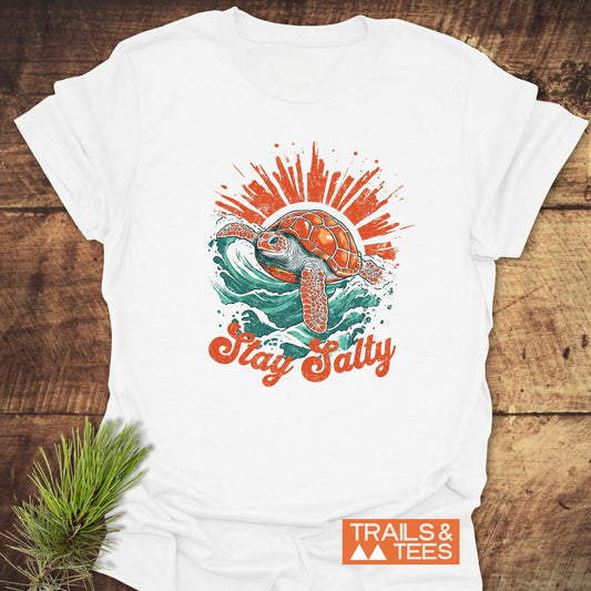 Stay Salty T-Shirt featuring a sea turtle and sunburst graphic, crafted from soft cotton for comfort and durability, perfect for outdoor adventures.