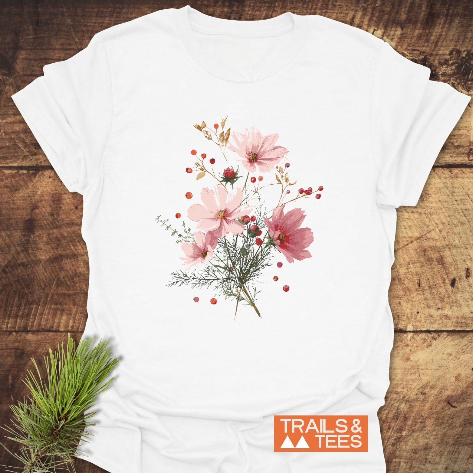 Wildflowers And Berries T-Shirt: White tee featuring a delicate floral design with pink cosmos blossoms, crafted for comfort and durability, embodying outdoor adventure spirit.