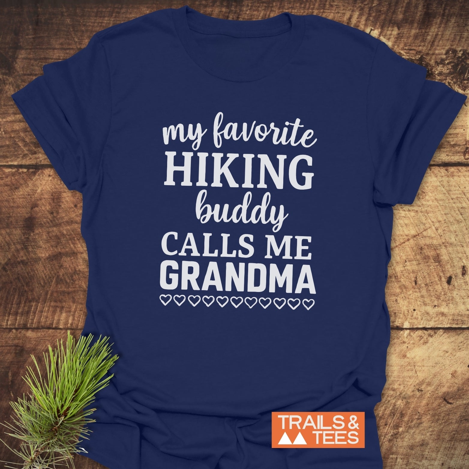 Navy-blue Hiking Grandma T-Shirt with phrase my favorite HIKING buddy CALLS ME GRANDMA in white, featuring durable print and soft cotton for outdoor comfort.