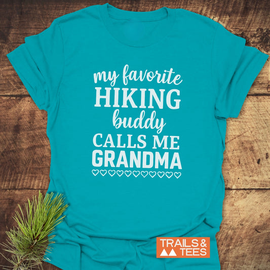 Hiking Grandma T-Shirt with white lettering and heart outlines, showcasing outdoor spirit. Features Trails & Tees logo on soft, ring-spun cotton.
