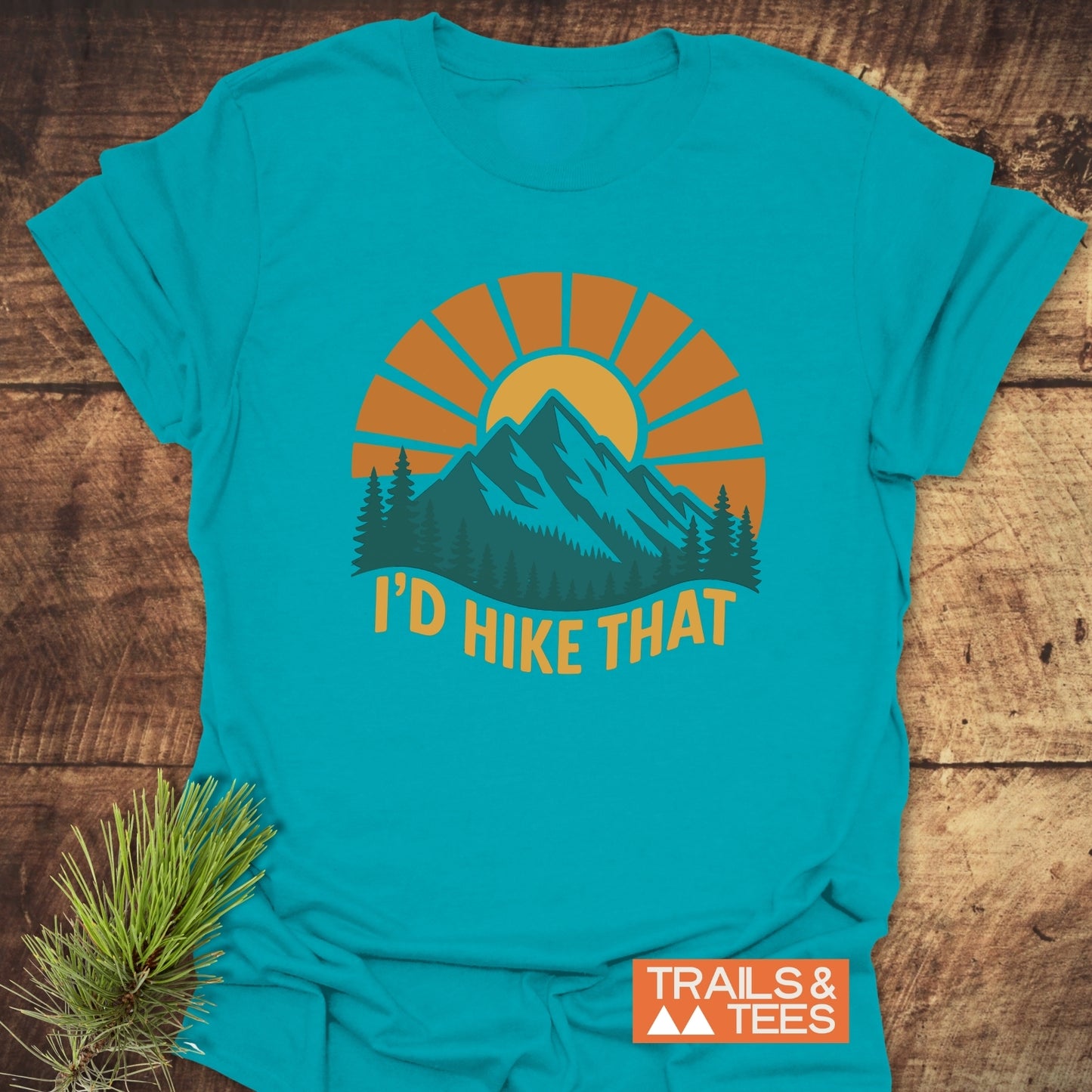 I'd Hike That T-Shirt with mountain and tree print, crafted from soft cotton for comfort, featuring durable prints. Ideal for outdoor enthusiasts.