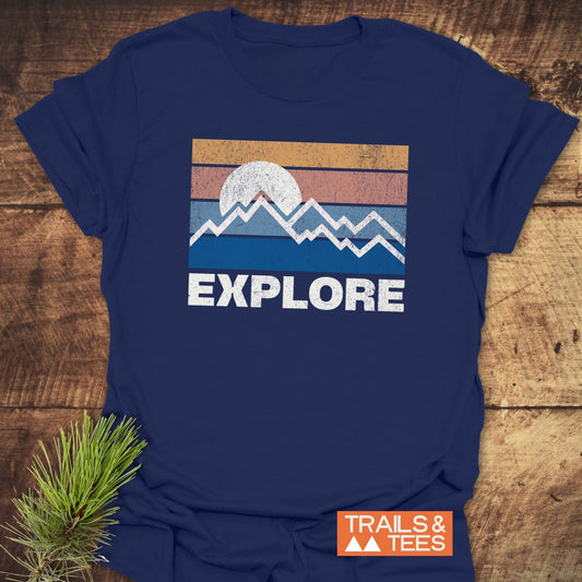 Explore Retro Sunset T-Shirt featuring a mountain silhouette and sun, crafted from soft cotton for comfort and durability, perfect for outdoor enthusiasts.