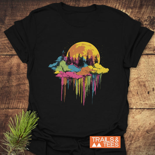 Moonlight Meltdown T-Shirt with golden moon and pine trees graphic, vibrant paint-drip design. Made of soft, lightweight cotton for outdoor adventures.