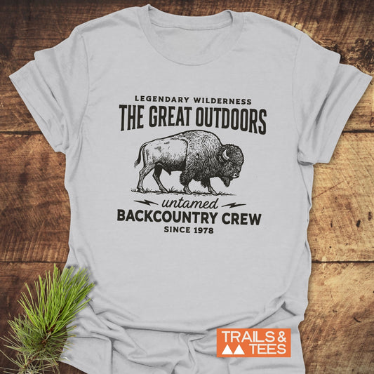 The Great Outdoors T-Shirt features a bison graphic with outdoor-themed text, crafted from soft cotton for comfort and durability, perfect for adventure lovers.