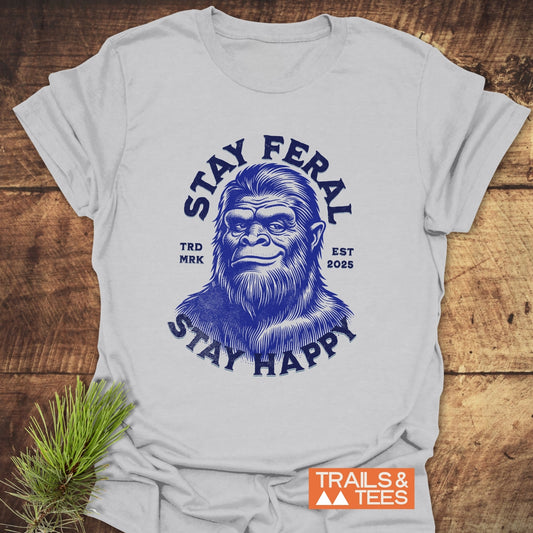 Stay Feral, Stay Happy T-Shirt featuring a bold Bigfoot face design, crafted from soft cotton for adventure-ready comfort, with durable prints and reliable fit.