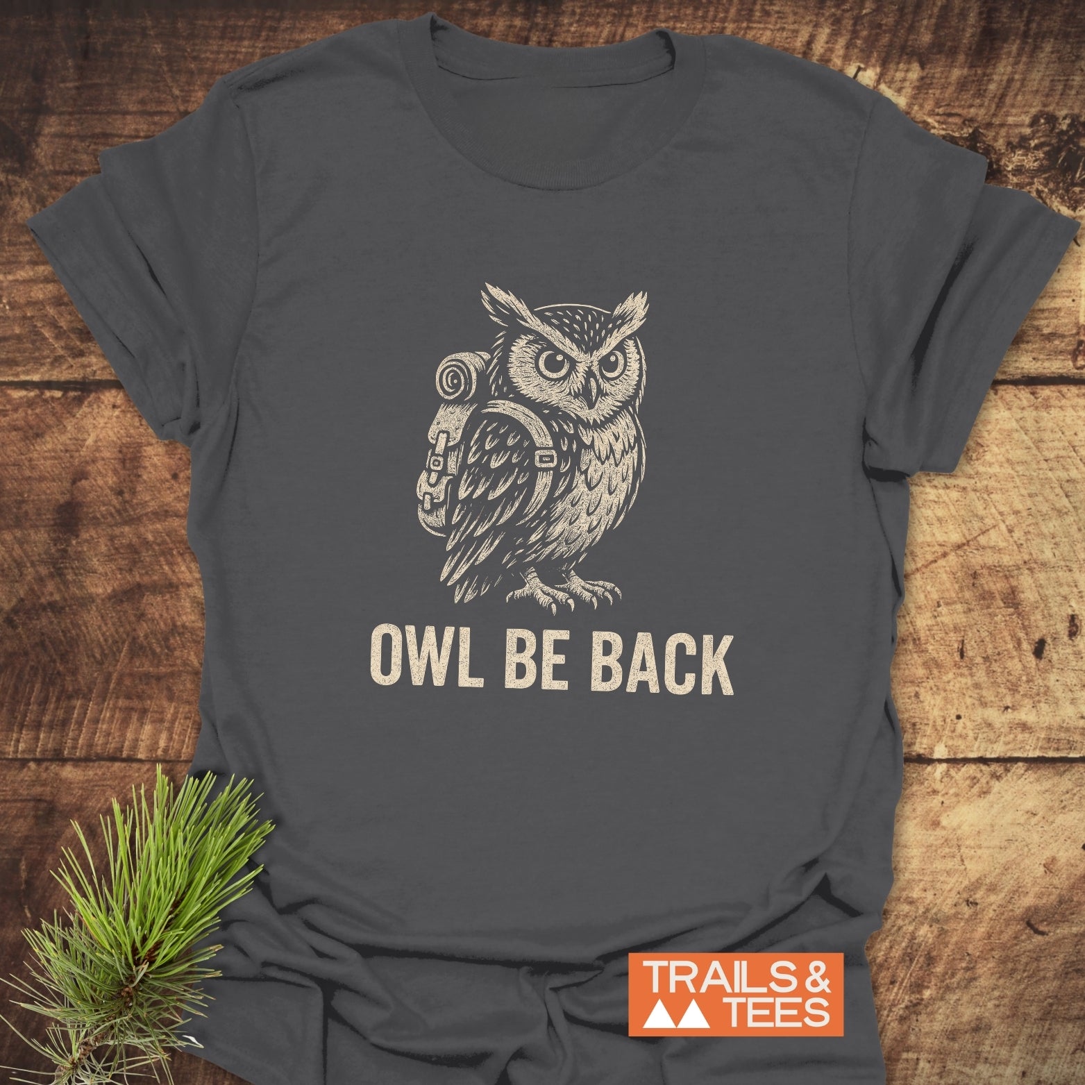 Owl Be Back Funny T-Shirt featuring a hand-drawn owl with a backpack and pun slogan, showcasing a comfortable, lightweight, adventure-ready design.