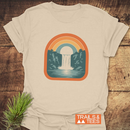 Vintage Waterfall T-Shirt featuring a retro rainbow and waterfall graphic. Made from soft cotton for comfort, with durable prints and pre-shrunk fit for outdoor enthusiasts.