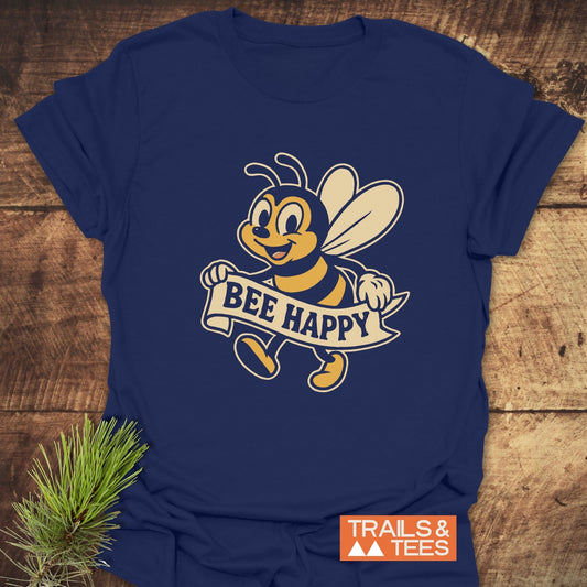 Bee Happy Cheerful T-Shirt with a retro cartoon bee and BEE HAPPY banner, crafted from soft cotton for comfort and durability. Featured by Trails & Tees.