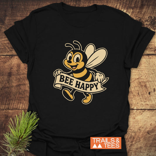 Bee Happy Cheerful T-Shirt featuring a retro cartoon bee with a “BEE HAPPY” banner, laid flat, emphasizing comfort and durability for outdoor adventures.